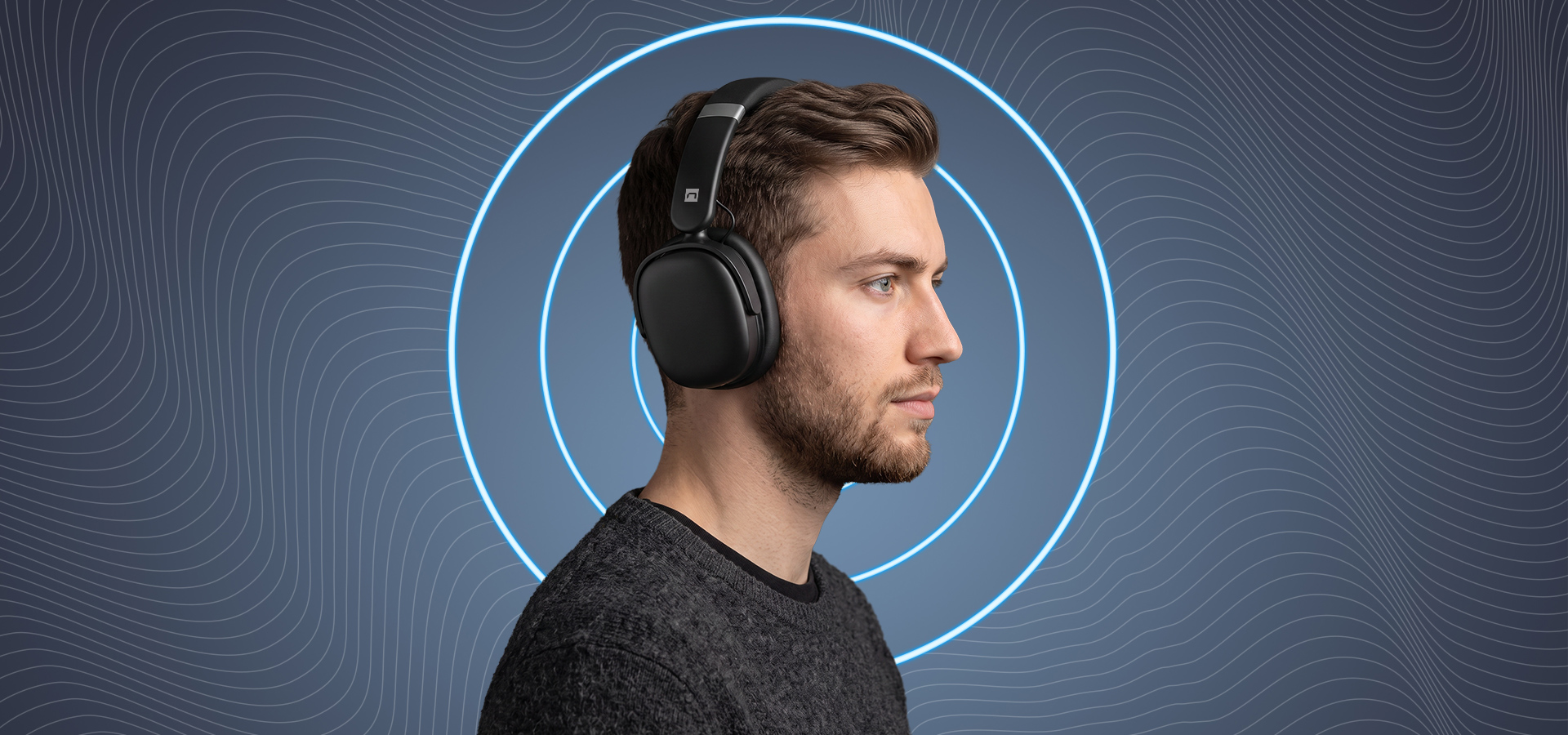 Man wearing black headphones with sound waves in the background.