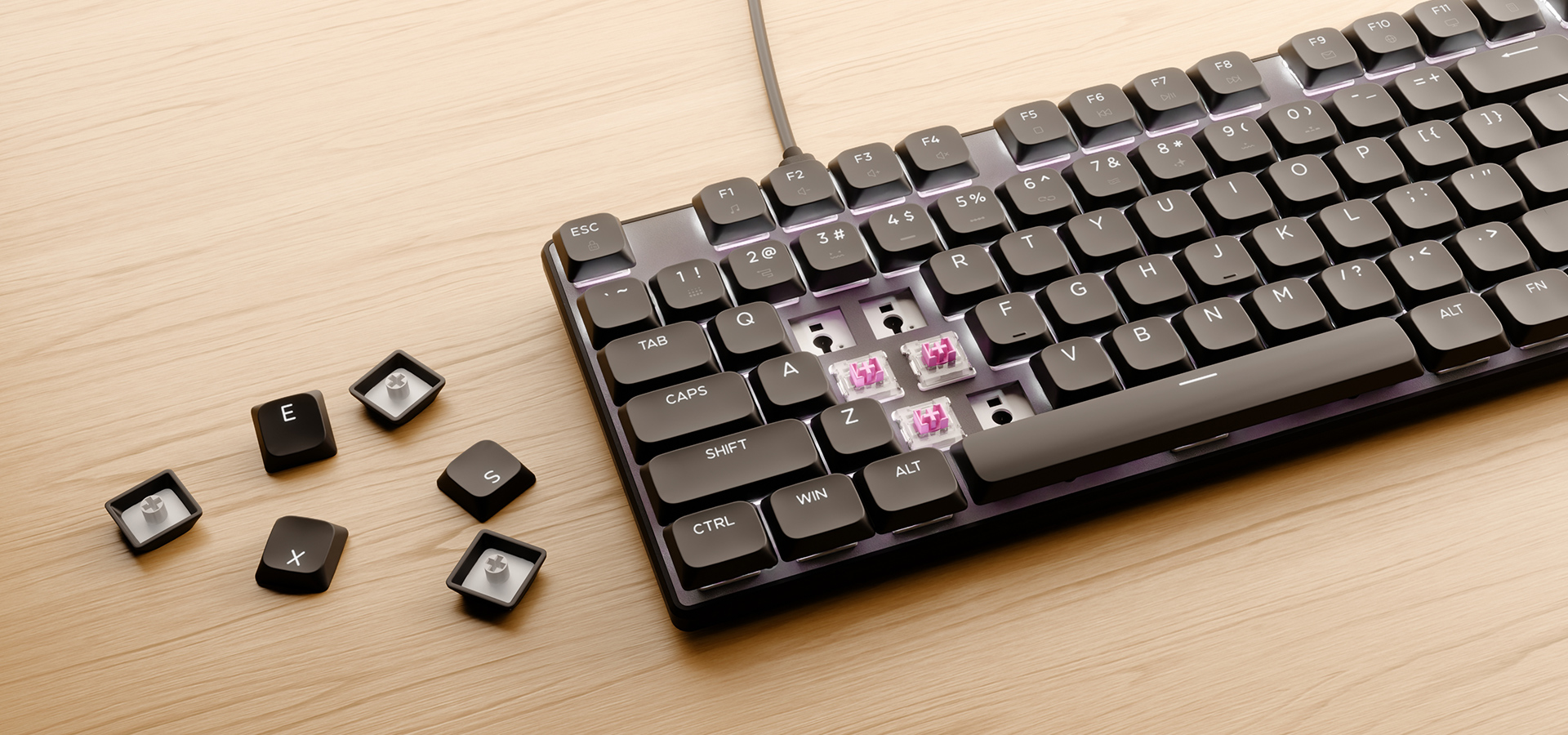 Keyboard with several removed keys and some keys lying beside it on a wooden surface.