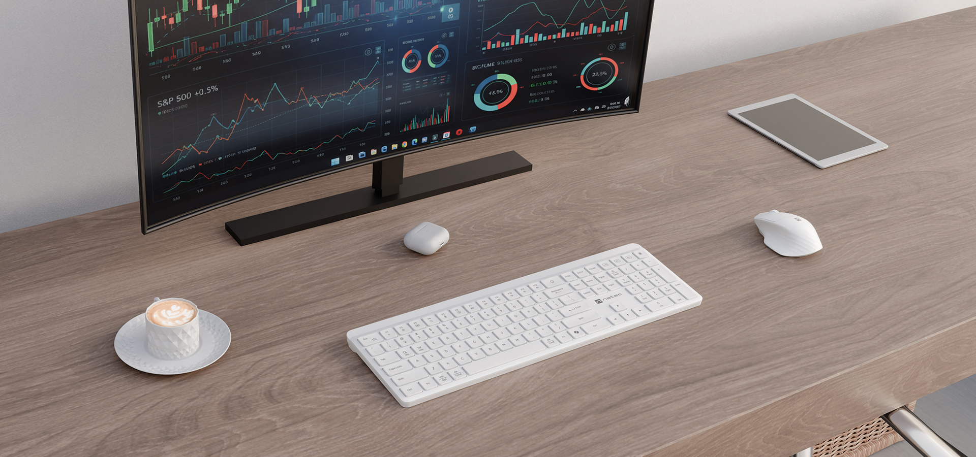 Zestaw biurkowy z monitorem wyświetlającym wykresy, klawiaturą, myszką i tabletem.