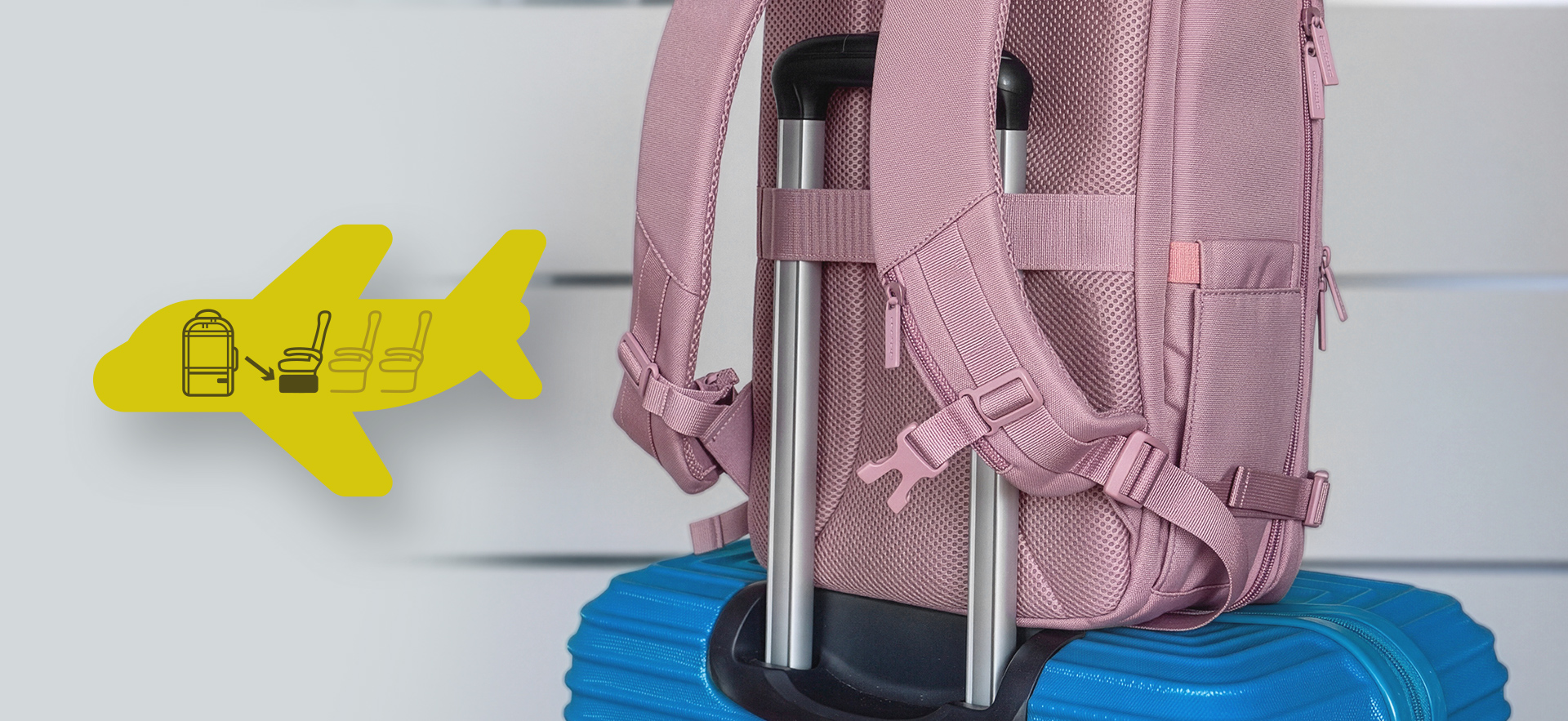 A pink backpack secured on a blue suitcase with a handle for easy transport.