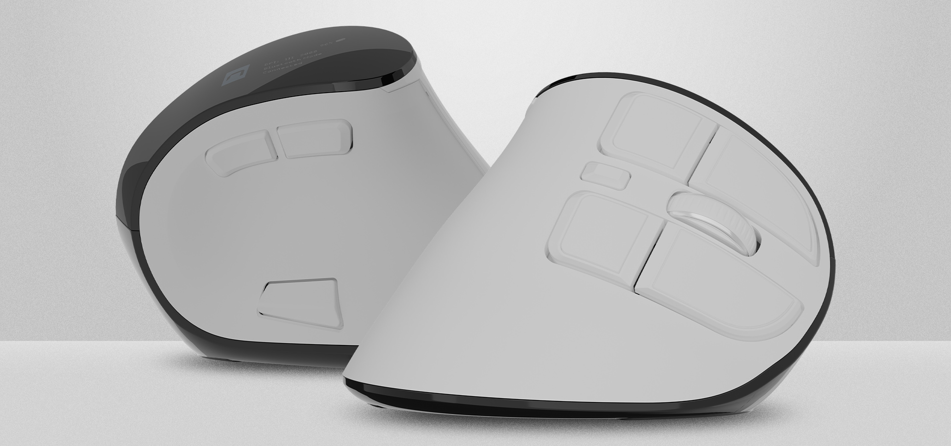 Dwa ergonomiczne myszy komputerowe ustawione pod kątem, prezentujące swój unikalny design i przyciski.