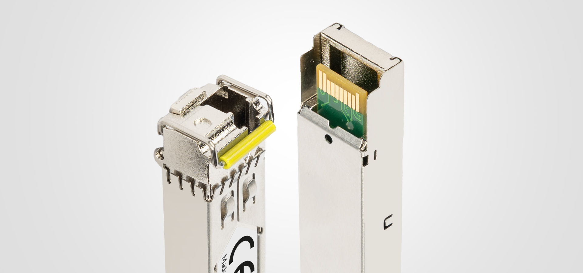 Two modular connectors with metal casings and gold contacts, one open and one closed.