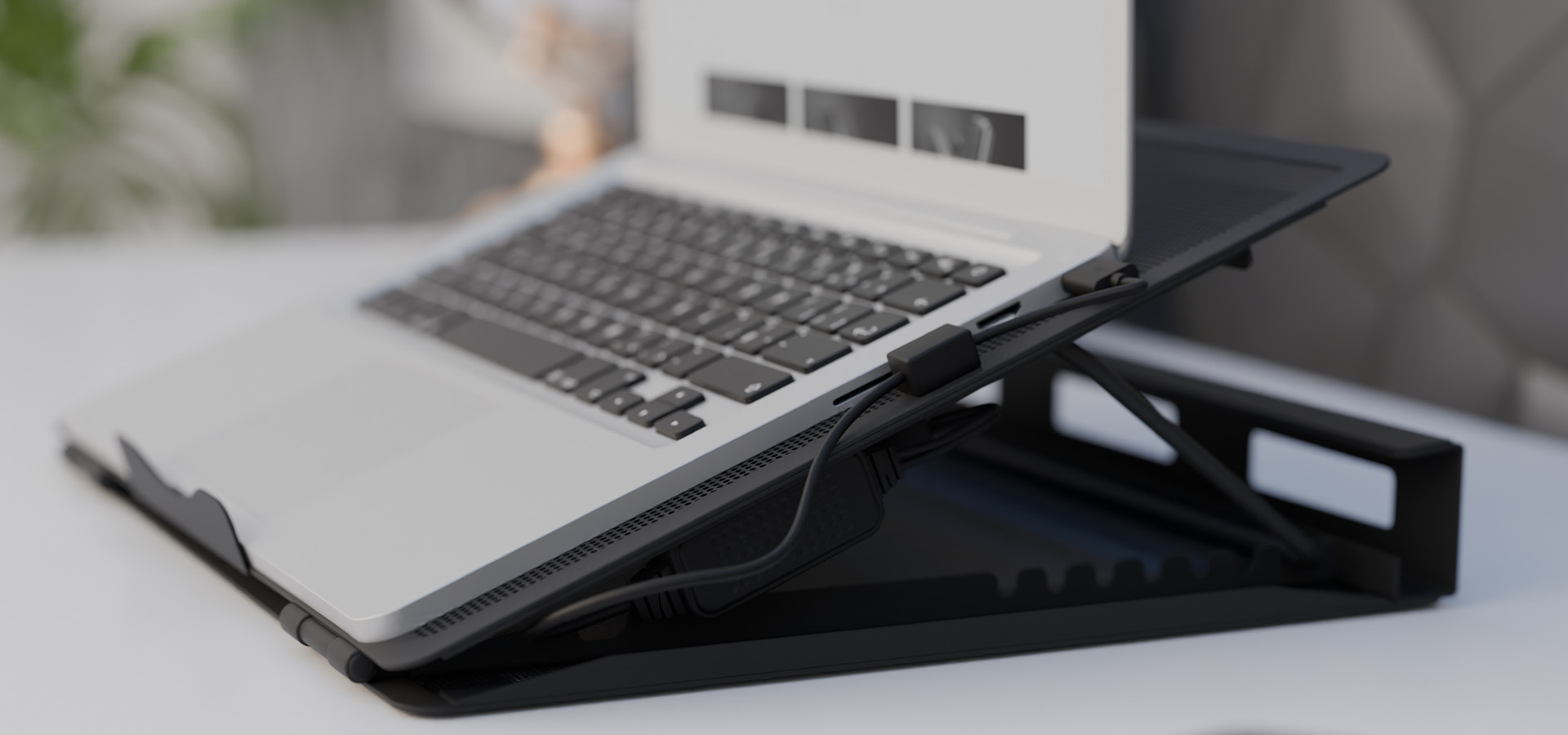 Laptop cooling pad NATEC TERN 2 PLUS with dual fans, supporting laptops from 12.1" to 17.3", shown at an angle on a desk