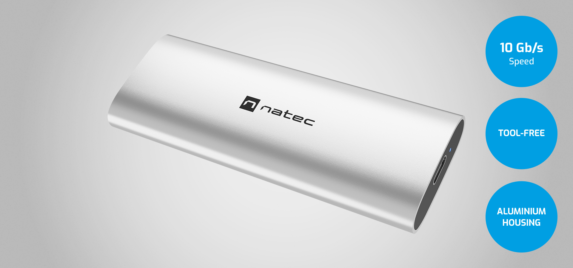 External storage device in silver with a smooth finish and connection port on one side.