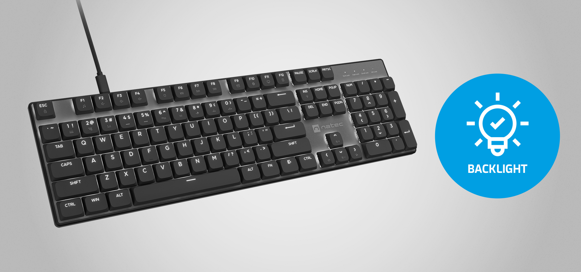 Keyboard with a connection cable and a glowing light icon.