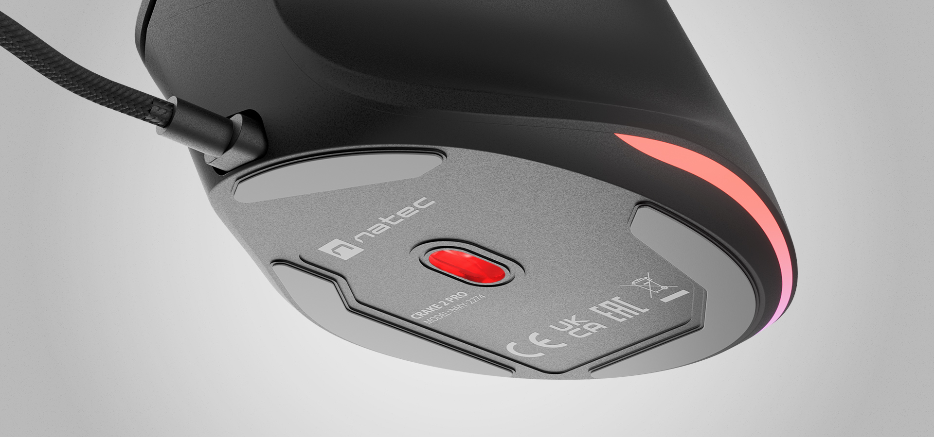 Gaming mouse bottom view with a red button and a glowing light accent.