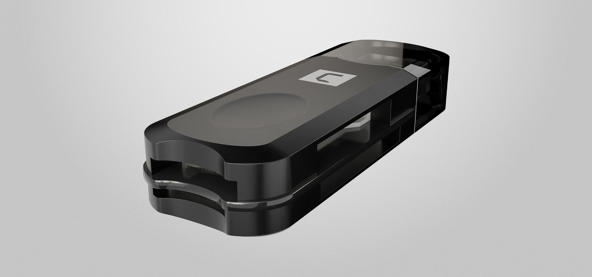 Małe czarne urządzenie do przechowywania o gładkiej powierzchni i zaokrąglonych krawędziach.