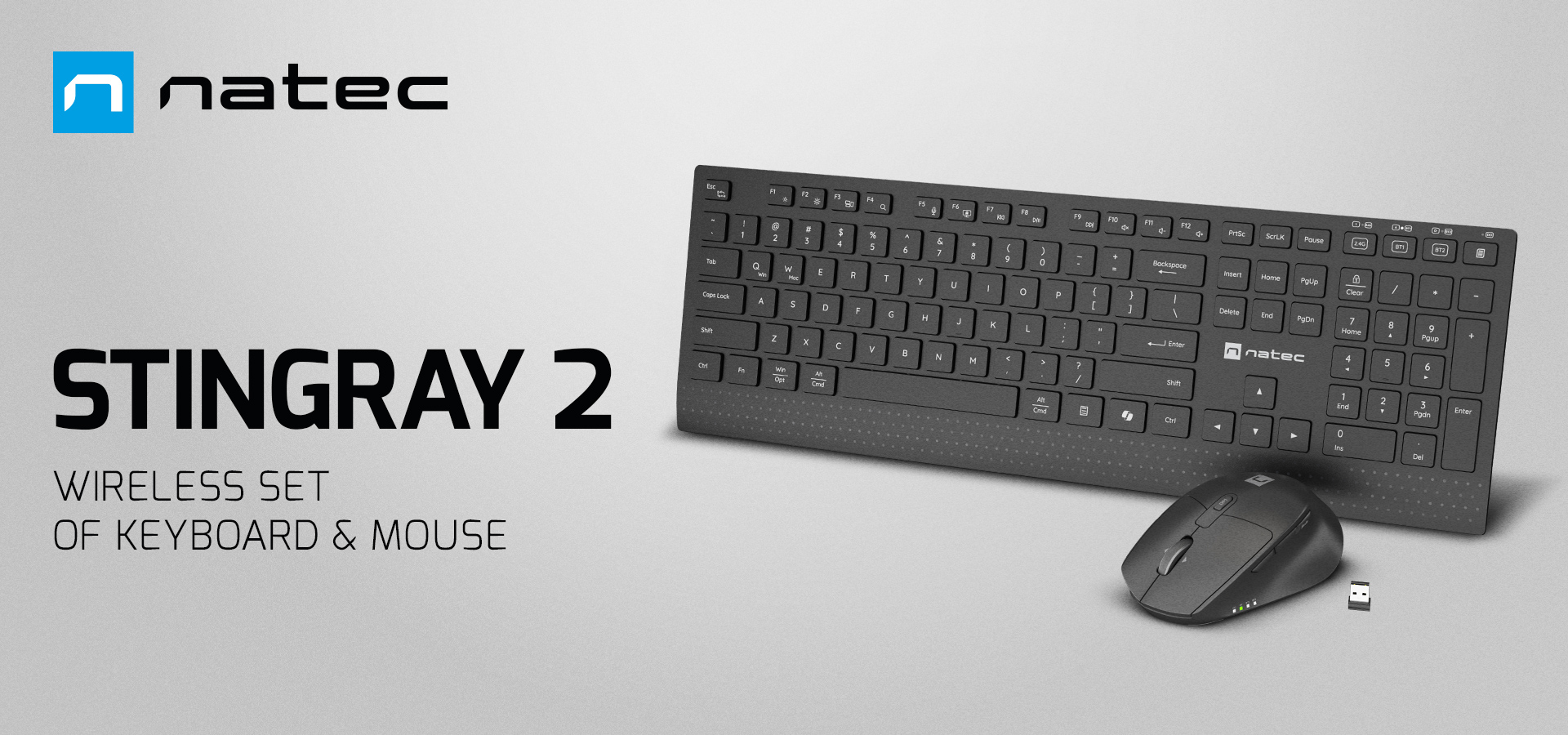 Wireless keyboard and mouse set in black with a sleek design and a connection dongle.