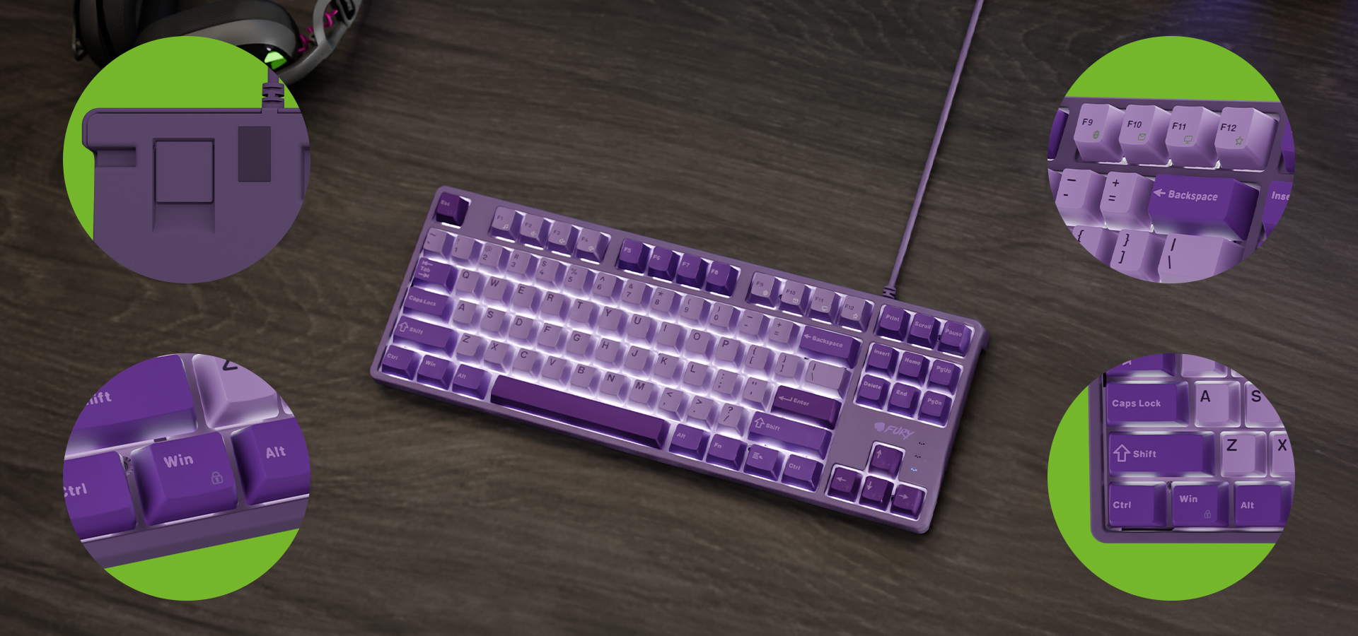 Fioletowa klawiatura z różnymi wzorami klawiszy i kablem połączeniowym na drewnianej powierzchni.