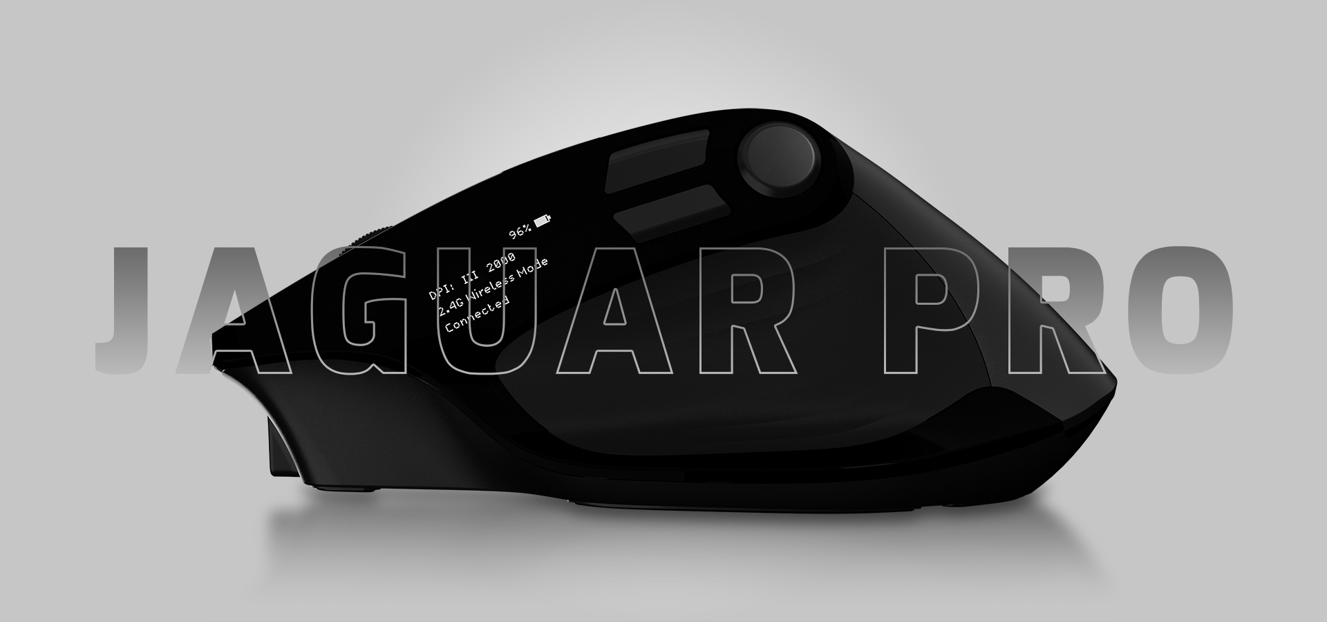 Black device with a glossy finish and a large button on the top surface.