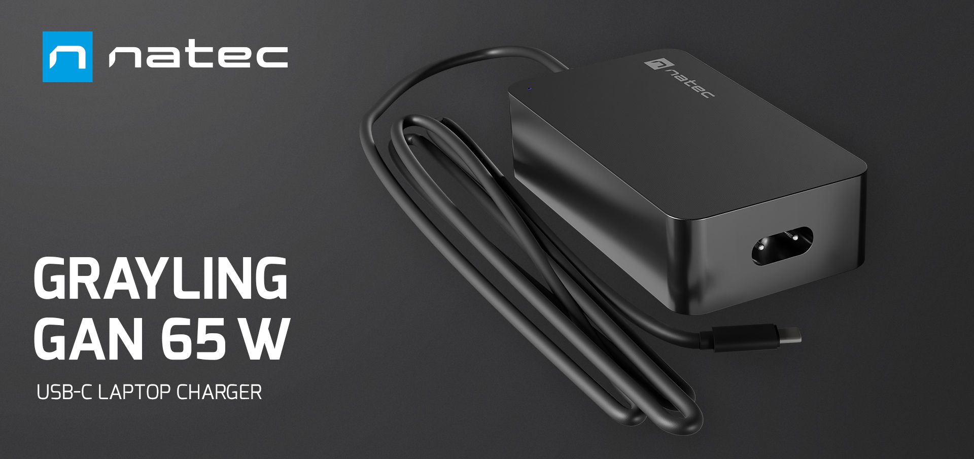 Compact black charger with a connection cable for laptops, tablets, and phones.