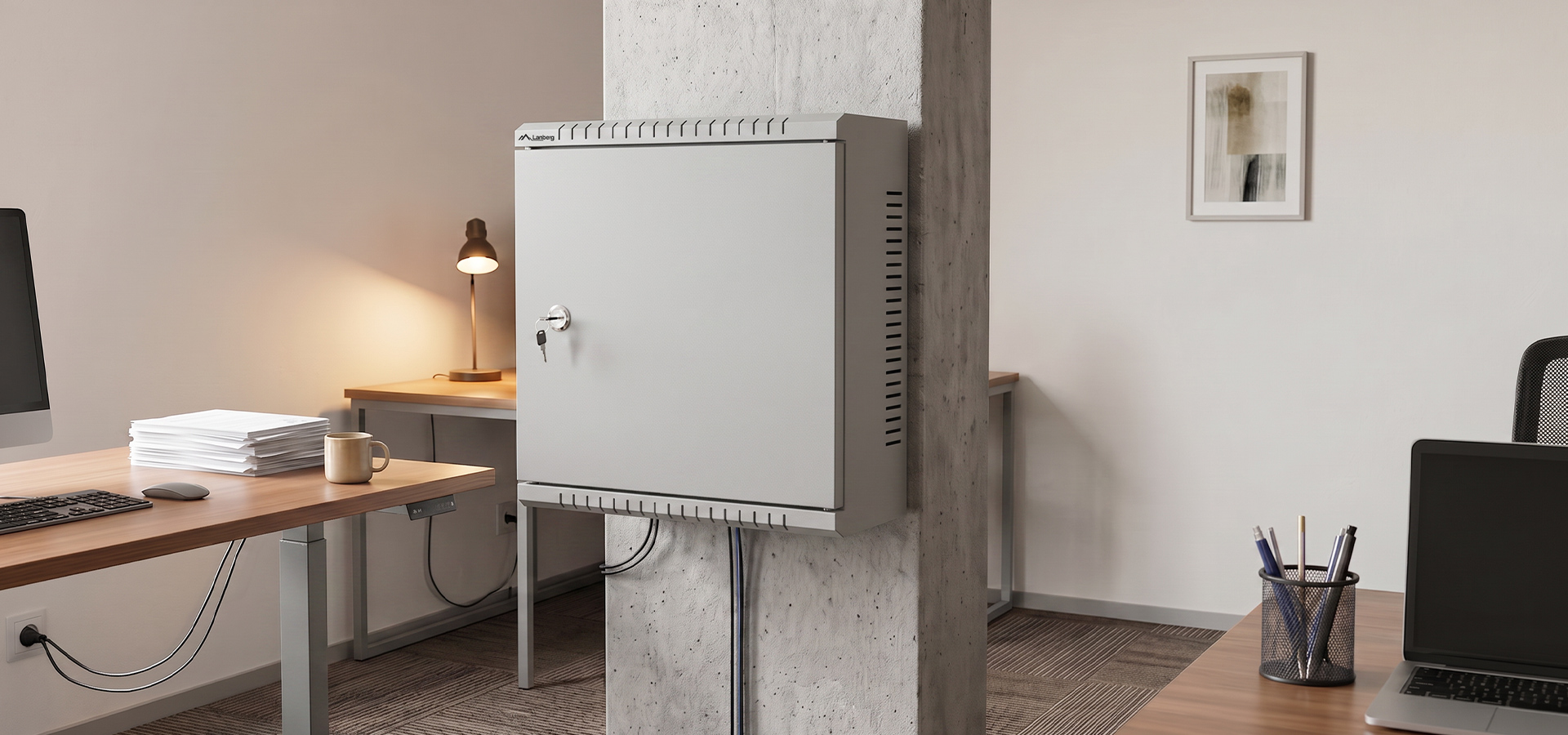 A gray wall-mounted cabinet secured with a key, located in a modern office space.