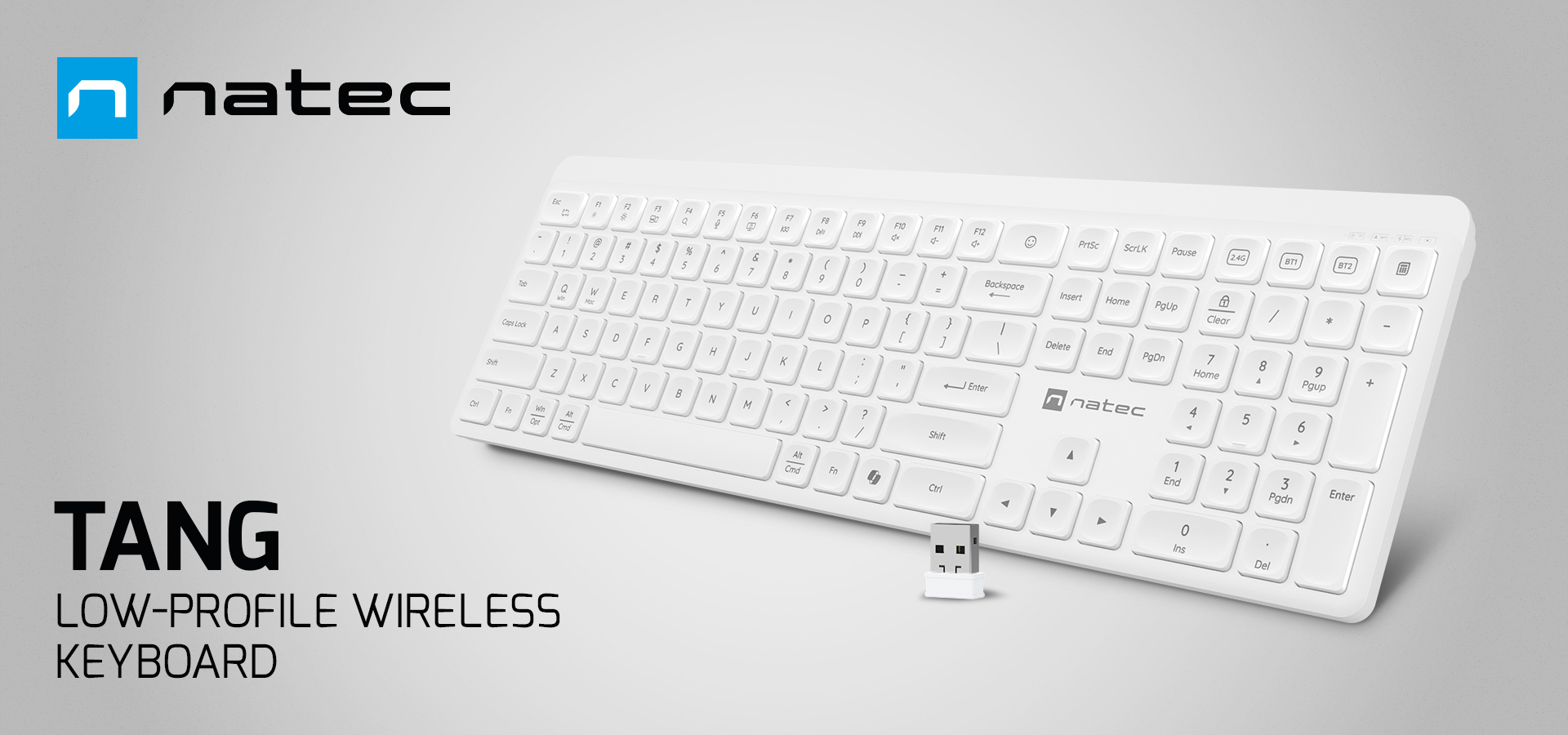 White low-profile keyboard with a connection adapter and a modern design.