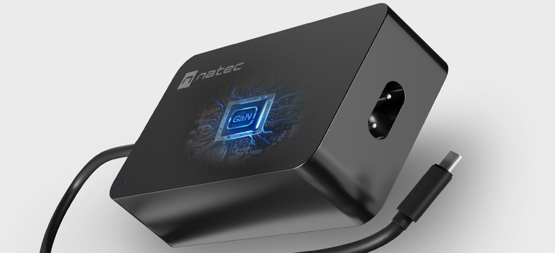 Zasilacz o czarnej obudowie, z przewodem podłączeniowym i podświetlonym elementem dekoracyjnym.